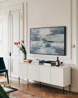 Clear  Water Indigo and Gray by Silvia Vassileva. shown as a framed stretched canvas in a living room above a console. Available as a archival giclee rolled canvas, fine art paper, or poster print. SKU 20866i.