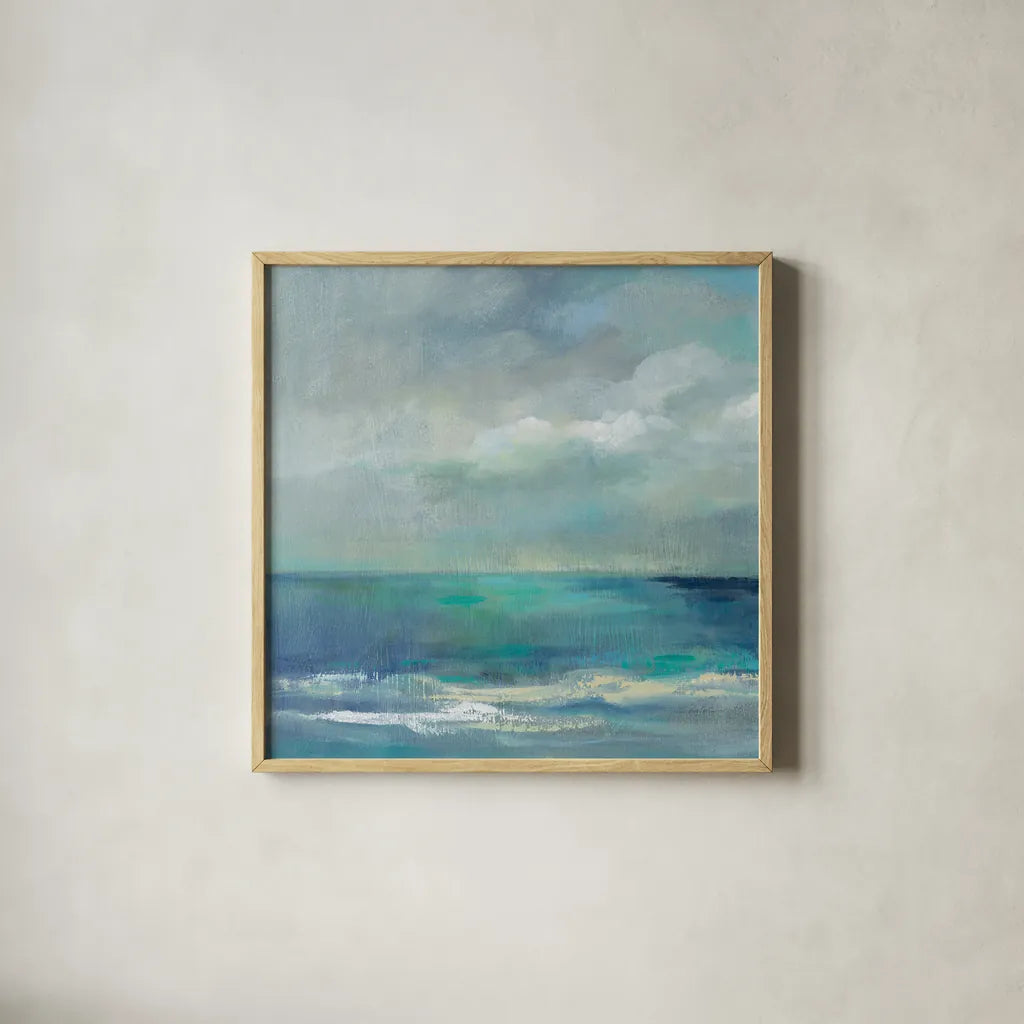 Clouds and Sea Crop II by Silvia Vassileva. Shown in a natural wood glass frame for a timeless modern aesthetic. Available as an archival giclee rolled canvas, fine art paper, or poster print. SKU 60287a.