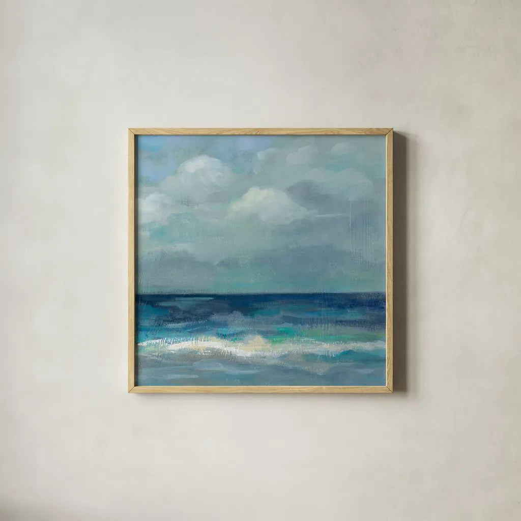 Clouds and Sea Crop III by Silvia Vassileva. Shown in a natural wood glass frame for a timeless modern aesthetic. Available as an archival giclee rolled canvas, fine art paper, or poster print. SKU 60288a.