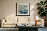 Coastal Blues II by Silvia Vassileva. Displayed in a glass frame with matte in a clean modern living room. Available as an archival giclee rolled canvas, fine art paper, or poster print. SKU 84818a.