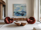 Coastal Blues II by Silvia Vassileva. Shown as extra-large giant wall art in a modern living room. Available as an archival giclee rolled canvas, fine art paper, or poster print. SKU 84818a.