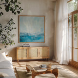 Coastal View II Aqua by Silvia Vassileva. Shown in a natural wood frame in a cozy modern living room. Available as an archival giclee rolled canvas, fine art paper, or poster print. SKU 65024a.