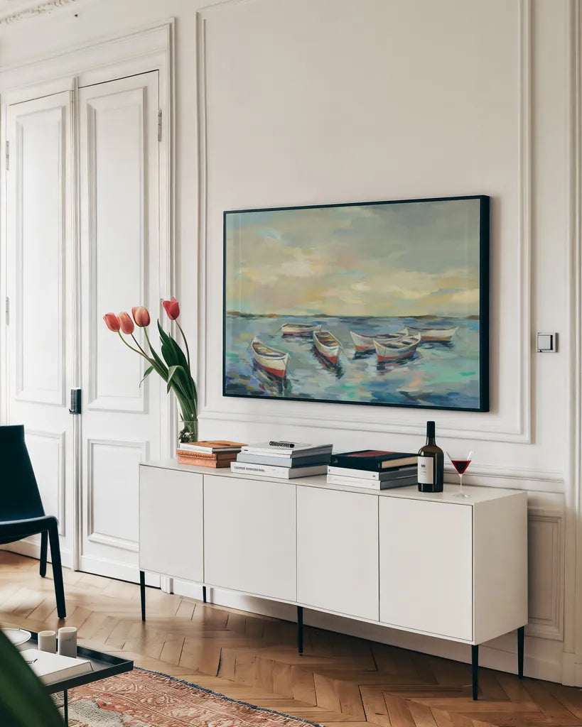 Coastal View of Boats by Silvia Vassileva. shown as a framed stretched canvas in a living room above a console. Available as a archival giclee rolled canvas, fine art paper, or poster print. SKU 54378i.