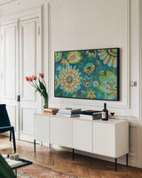Decorative Peacock Floral by Silvia Vassileva. shown as a framed stretched canvas in a living room above a console. Available as a archival giclee rolled canvas, fine art paper, or poster print. SKU 26439i.