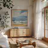Del Mar Sky I by Silvia Vassileva. Shown in a natural wood frame in a cozy modern living room. Available as an archival giclee rolled canvas, fine art paper, or poster print. SKU 79155a.