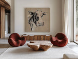Expressionistic Cow I Neutral Burlap by Silvia Vassileva. Shown as extra-large giant wall art in a modern living room. Available as an archival giclee rolled canvas, fine art paper, or poster print. SKU 101475a.