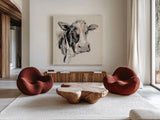 Expressionistic Cow I Neutral Linen by Silvia Vassileva. Shown as extra-large giant wall art in a modern living room. Available as an archival giclee rolled canvas, fine art paper, or poster print. SKU 52890a.