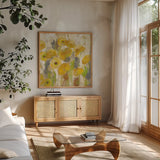 Floating Yellow Flowers V by Silvia Vassileva. Shown in a natural wood frame in a cozy modern living room. Available as an archival giclee rolled canvas, fine art paper, or poster print. SKU 27815a.