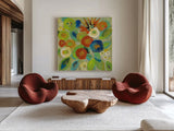 Flower Market II Cool by Silvia Vassileva. Shown as extra-large giant wall art in a modern living room. Available as an archival giclee rolled canvas, fine art paper, or poster print. SKU 27641a.