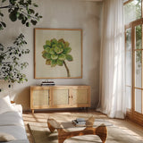 Front Yard Succulent IV by Silvia Vassileva. Shown in a natural wood frame in a cozy modern living room. Available as an archival giclee rolled canvas, fine art paper, or poster print. SKU 47319a.