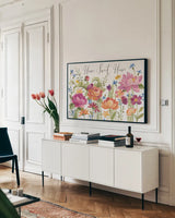 Garden Party V by Silvia Vassileva. shown as a framed stretched canvas in a living room above a console. Available as a archival giclee rolled canvas, fine art paper, or poster print. SKU 61573i.