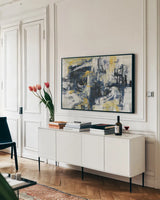Graffiti Wall III Indigo Crop by Silvia Vassileva. shown as a framed stretched canvas in a living room above a console. Available as a archival giclee rolled canvas, fine art paper, or poster print. SKU 28859i.