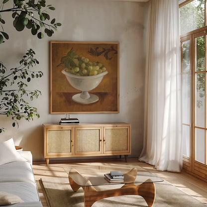 Grapes in Old Bowl by Silvia Vassileva. Shown in a natural wood frame in a cozy modern living room. Available as an archival giclee rolled canvas, fine art paper, or poster print. SKU 60343a.