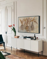 Grasses and Baskets by Silvia Vassileva. shown as a framed stretched canvas in a living room above a console. Available as a archival giclee rolled canvas, fine art paper, or poster print. SKU 75421i.