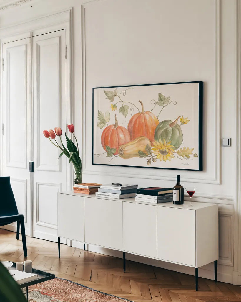 Happy Harvest Pumpkins by Silvia Vassileva. shown as a framed stretched canvas in a living room above a console. Available as a archival giclee rolled canvas, fine art paper, or poster print. SKU 75100i.