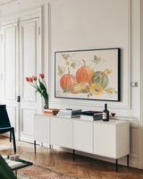 Happy Harvest Pumpkins by Silvia Vassileva. shown as a framed stretched canvas in a living room above a console. Available as a archival giclee rolled canvas, fine art paper, or poster print. SKU 75100i.