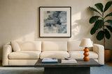 In the Clouds Indigo and Gray Crop by Silvia Vassileva. Displayed in a glass frame with matte in a clean modern living room. Available as an archival giclee rolled canvas, fine art paper, or poster print. SKU 20867a.