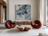 In the Clouds Indigo and Gray Crop by Silvia Vassileva. Shown as extra-large giant wall art in a modern living room. Available as an archival giclee rolled canvas, fine art paper, or poster print. SKU 20867a.