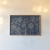 Indigo Floral I by Silvia Vassileva. shown as a paper print in a natural frame. Available as a archival giclee rolled canvas, fine art paper, or poster print. SKU 29153i.