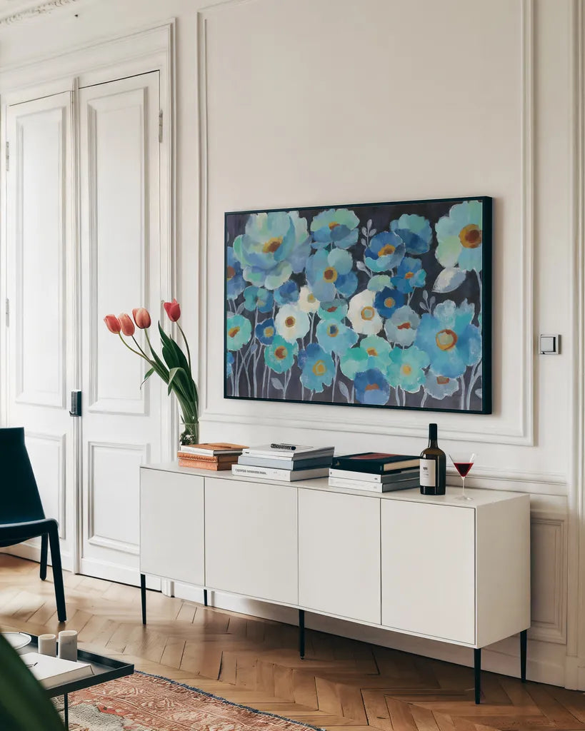 Indigo Flowers by Silvia Vassileva. shown as a framed stretched canvas in a living room above a console. Available as a archival giclee rolled canvas, fine art paper, or poster print. SKU 17474i.