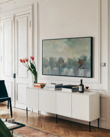 Indigo Haze by Silvia Vassileva. shown as a framed stretched canvas in a living room above a console. Available as a archival giclee rolled canvas, fine art paper, or poster print. SKU 95135i.