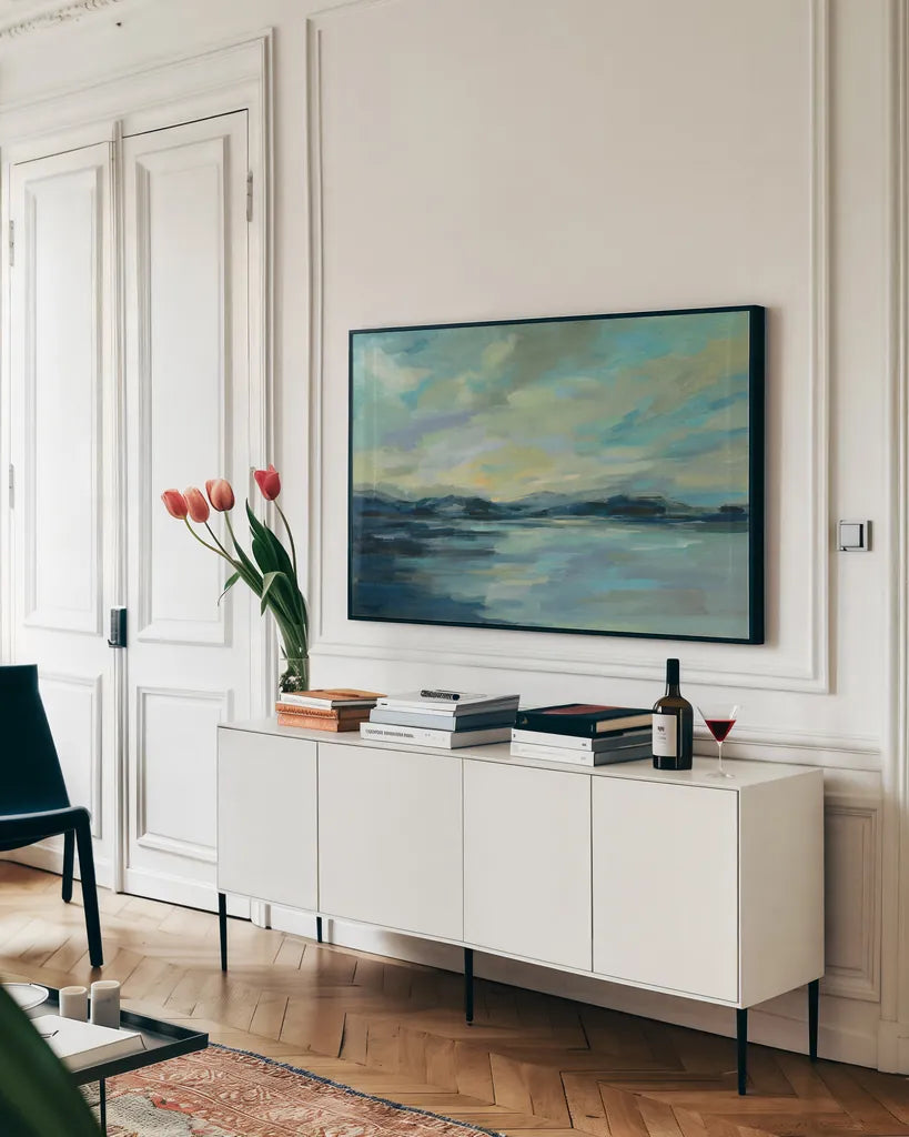 Indigo Sea by Silvia Vassileva. shown as a framed stretched canvas in a living room above a console. Available as a archival giclee rolled canvas, fine art paper, or poster print. SKU 56259i.