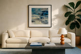 Indigo Wave by Silvia Vassileva. Displayed in a glass frame with matte in a clean modern living room. Available as an archival giclee rolled canvas, fine art paper, or poster print. SKU 21582a.