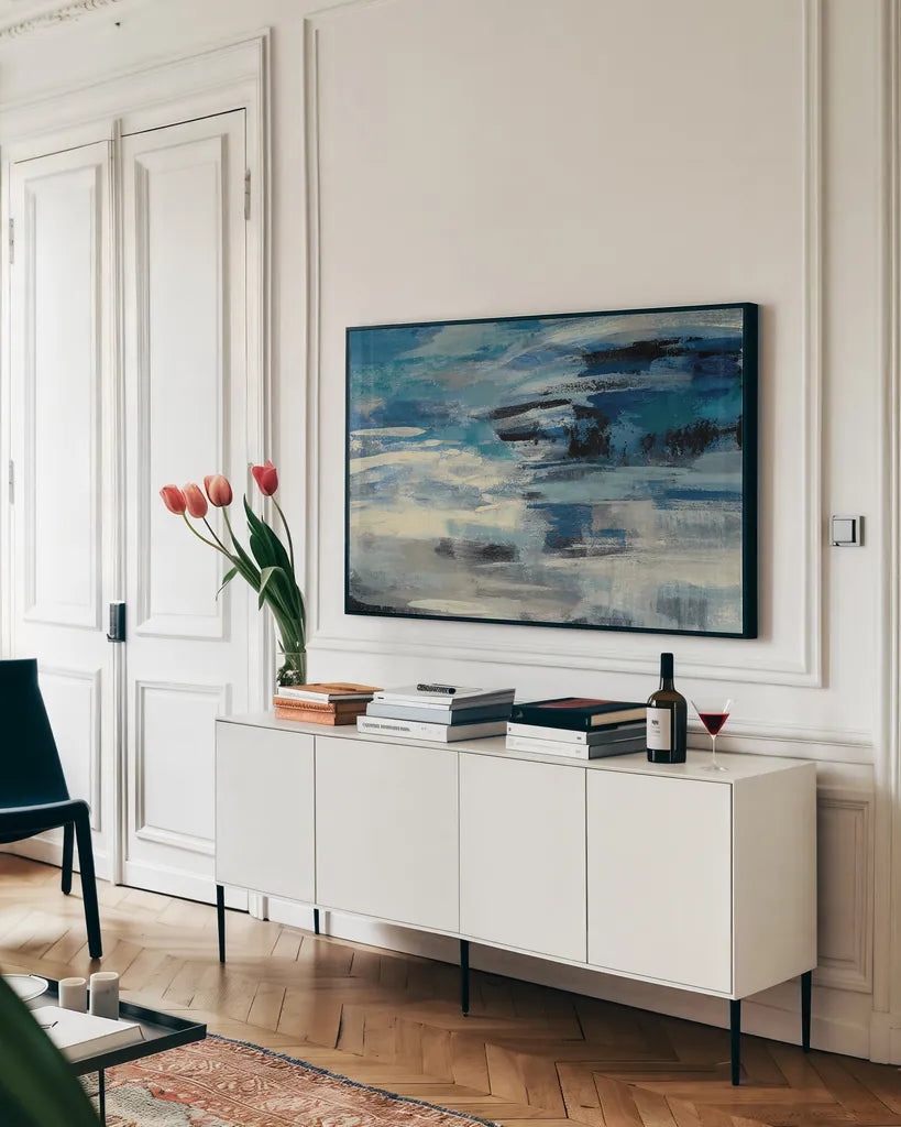 Indigo Wave Crop by Silvia Vassileva. shown as a framed stretched canvas in a living room above a console. Available as a archival giclee rolled canvas, fine art paper, or poster print. SKU 21582i.