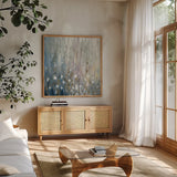 January Branches by Silvia Vassileva. Shown in a natural wood frame in a cozy modern living room. Available as an archival giclee rolled canvas, fine art paper, or poster print. SKU 42129a.
