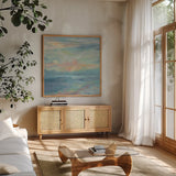 June Morning by the Sea by Silvia Vassileva. Shown in a natural wood frame in a cozy modern living room. Available as an archival giclee rolled canvas, fine art paper, or poster print. SKU 65249a.