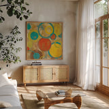 Kaleidoscope III by Silvia Vassileva. Shown in a natural wood frame in a cozy modern living room. Available as an archival giclee rolled canvas, fine art paper, or poster print. SKU 10213a.