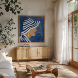 Lady with Hat I by Silvia Vassileva. Shown in a natural wood frame in a cozy modern living room. Available as an archival giclee rolled canvas, fine art paper, or poster print. SKU 67915a.