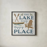 Lakeside Retreat IX Canoe by Silvia Vassileva. Shown in a sleek black glass frame for a contemporary gallery look. Available as an archival giclee rolled canvas, fine art paper, or poster print. SKU 74112a.