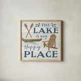 Lakeside Retreat IX Canoe by Silvia Vassileva. Shown in a natural wood glass frame for a timeless modern aesthetic. Available as an archival giclee rolled canvas, fine art paper, or poster print. SKU 74112a.