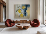 Lemons From the South I by Silvia Vassileva. Shown as extra-large giant wall art in a modern living room. Available as an archival giclee rolled canvas, fine art paper, or poster print. SKU 88697a.