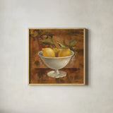 Lemons in Old Bowl by Silvia Vassileva. Shown in a natural wood glass frame for a timeless modern aesthetic. Available as an archival giclee rolled canvas, fine art paper, or poster print. SKU 60345a.