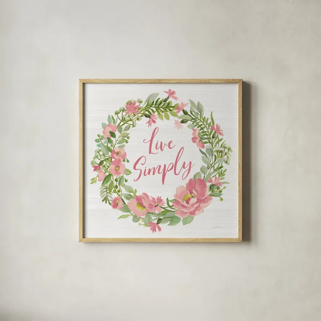 Live Simply Blush by Silvia Vassileva. Shown in a natural wood glass frame for a timeless modern aesthetic. Available as an archival giclee rolled canvas, fine art paper, or poster print. SKU 61860a.