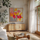 Magenta Bloom I by Silvia Vassileva. Shown in a natural wood frame in a cozy modern living room. Available as an archival giclee rolled canvas, fine art paper, or poster print. SKU 83089a.