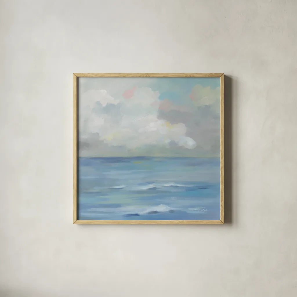 Morning Seaside Clouds by Silvia Vassileva. Shown in a natural wood glass frame for a timeless modern aesthetic. Available as an archival giclee rolled canvas, fine art paper, or poster print. SKU 71289a.
