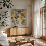 Neutral Floral Beige III Yellow Flowers by Silvia Vassileva. Shown in a natural wood frame in a cozy modern living room. Available as an archival giclee rolled canvas, fine art paper, or poster print. SKU 28407a.