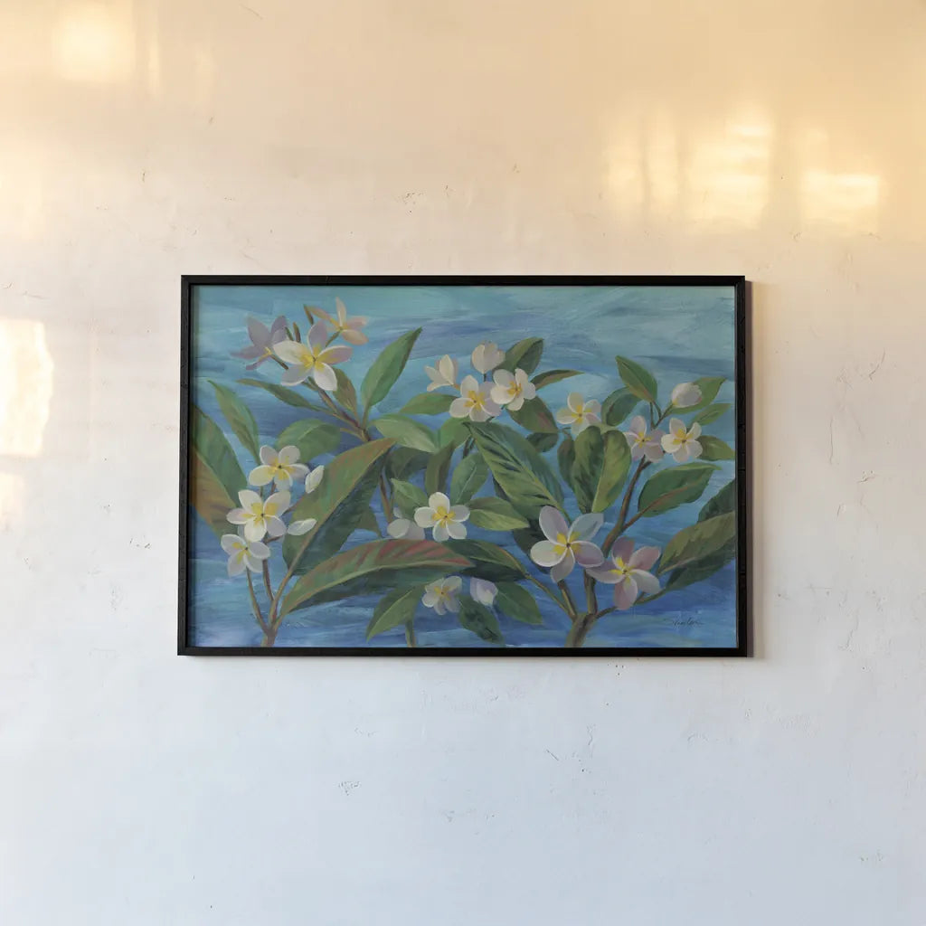 Oceanside Plumeria by Silvia Vassileva. shown as a paper print in a black flame. Available as a archival giclee rolled canvas, fine art paper, or poster print. SKU 68341i.