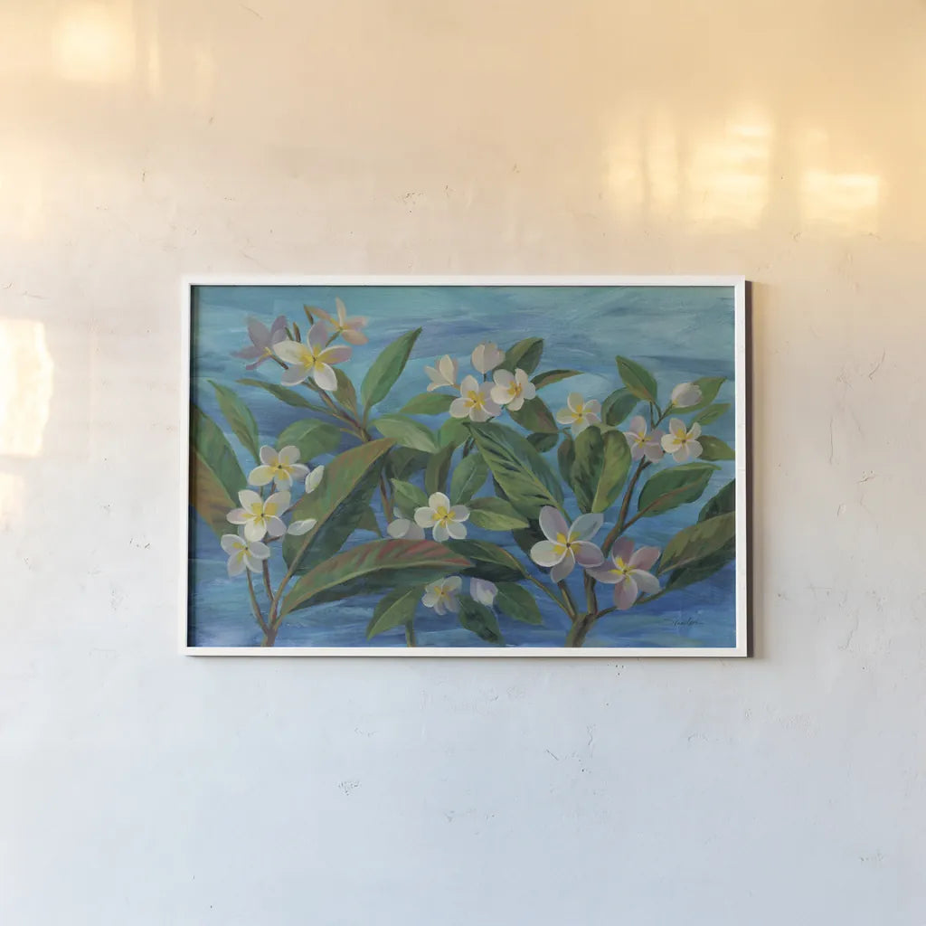 Oceanside Plumeria by Silvia Vassileva. shown as a paper print in a white frame. Available as a archival giclee rolled canvas, fine art paper, or poster print. SKU 68341i.