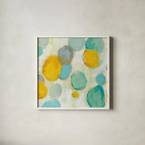Painted Pebbles II by Silvia Vassileva. Shown in a crisp white glass frame for a clean and minimalist style. Available as an archival giclee rolled canvas, fine art paper, or poster print. SKU 22334a.