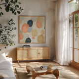 Painted Pebbles II Boho by Silvia Vassileva. Shown in a natural wood frame in a cozy modern living room. Available as an archival giclee rolled canvas, fine art paper, or poster print. SKU 67875a.