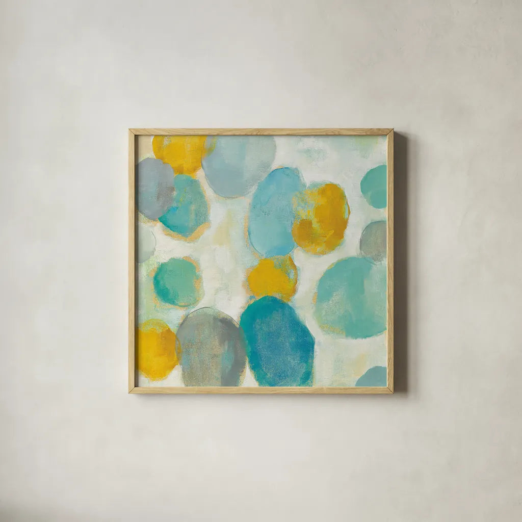Painted Pebbles III by Silvia Vassileva. Shown in a natural wood glass frame for a timeless modern aesthetic. Available as an archival giclee rolled canvas, fine art paper, or poster print. SKU 22335a.