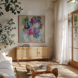 Pink and Blue II by Silvia Vassileva. Shown in a natural wood frame in a cozy modern living room. Available as an archival giclee rolled canvas, fine art paper, or poster print. SKU 21900a.