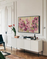Pink and Green Bloom by Silvia Vassileva. shown as a framed stretched canvas in a living room above a console. Available as a archival giclee rolled canvas, fine art paper, or poster print. SKU 62962i.