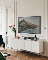 Ragged Beach by Silvia Vassileva. shown as a framed stretched canvas in a living room above a console. Available as a archival giclee rolled canvas, fine art paper, or poster print. SKU 103532i.