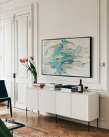 River Whirlpool by Silvia Vassileva. shown as a framed stretched canvas in a living room above a console. Available as a archival giclee rolled canvas, fine art paper, or poster print. SKU 27122i.