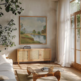 River and Clouds II by Silvia Vassileva. Shown in a natural wood frame in a cozy modern living room. Available as an archival giclee rolled canvas, fine art paper, or poster print. SKU 86031a.